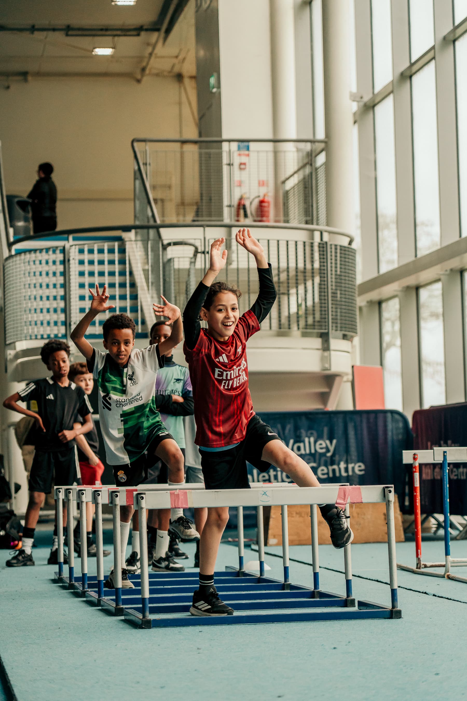Young athlete on a running track preparing to start a sprint