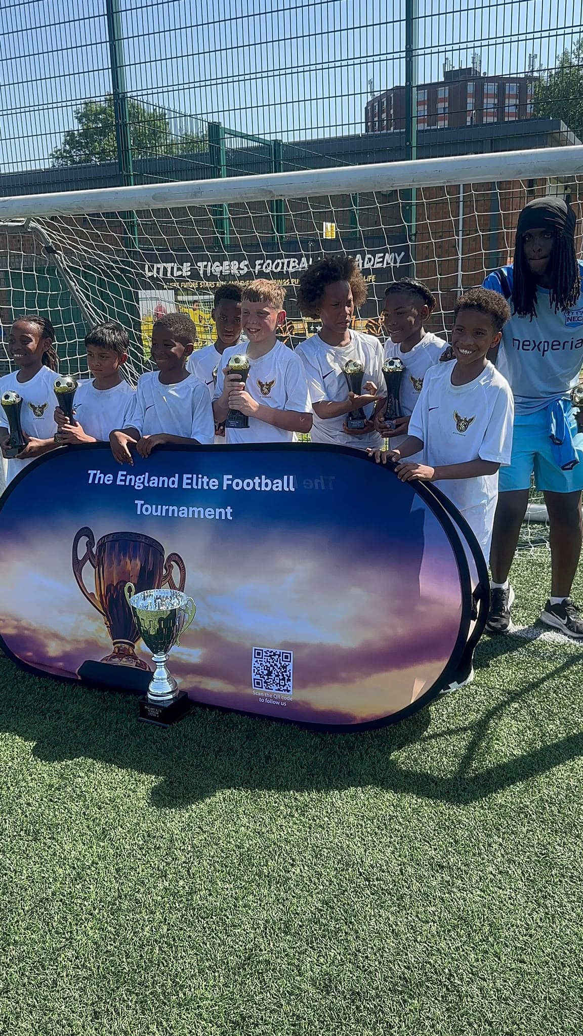 Supreme Showcase squad at The England Elite Football Tournament with trophies